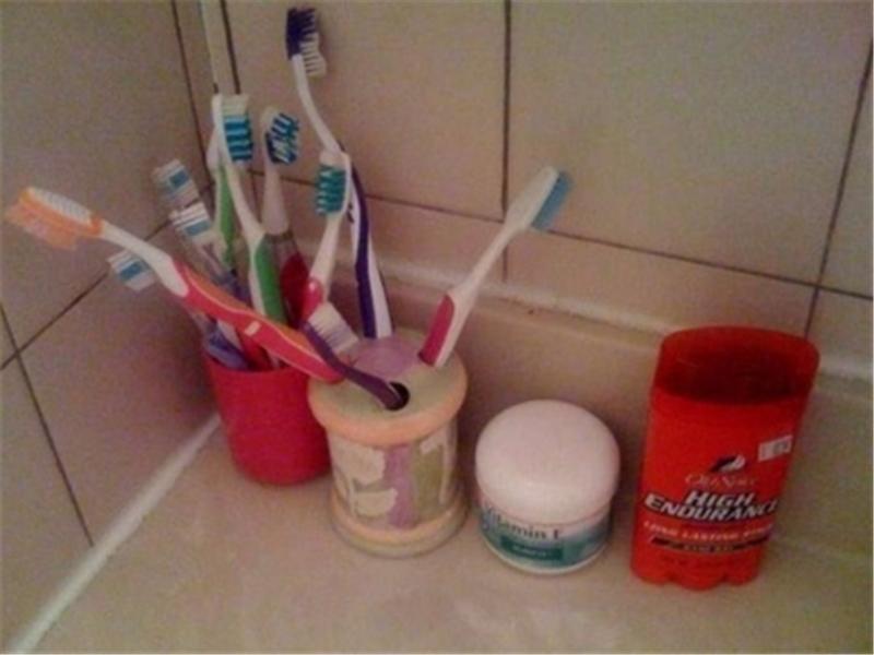 Most Toothbrushes On Bathroom Counter
