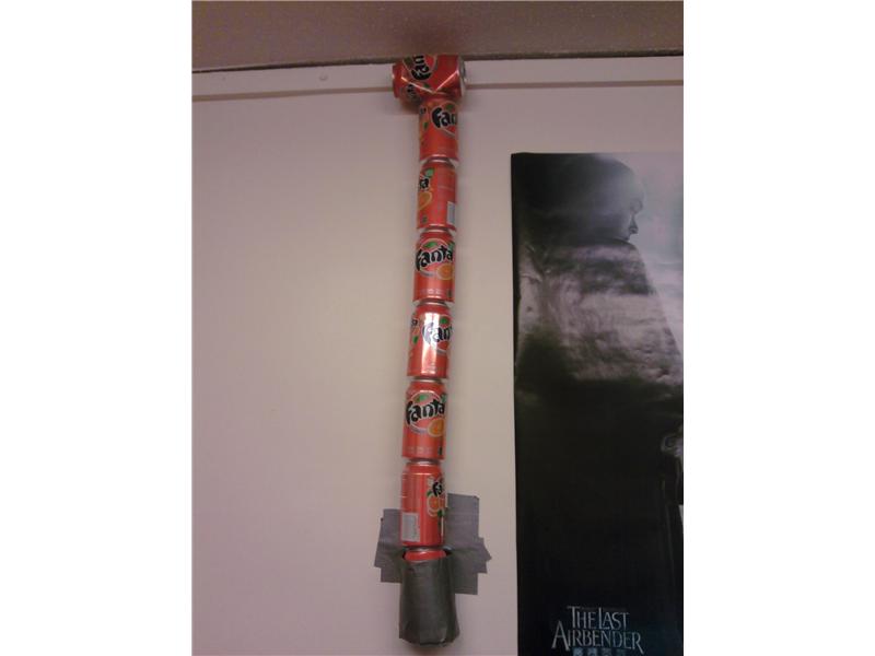 Most Cans Of Fanta Attached To Wall With Duct Tape