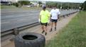 Fastest Time For Two People To Flip A 100-Kilogram Tire Four Kilometers