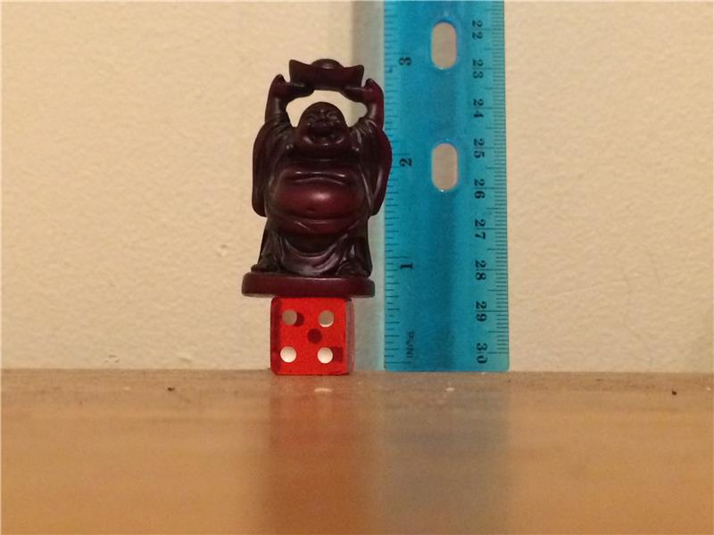 Shortest Buddha Statue Balanced On A Die