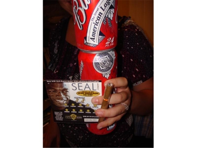 Most 24-Ounce Cans Of Budweiser Held In One Hand With An Optimo Cigar And Lottery Ticket