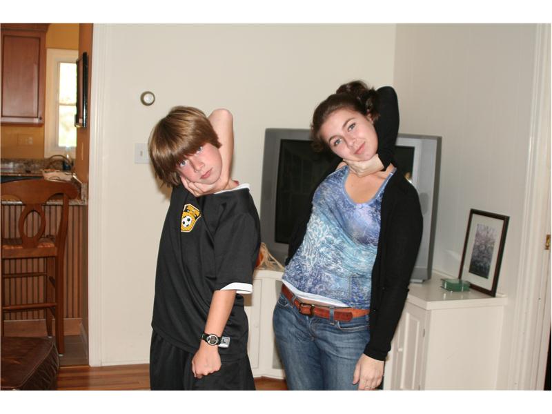 Largest Group Of People Wrapping Arm Around Head To Touch Ear