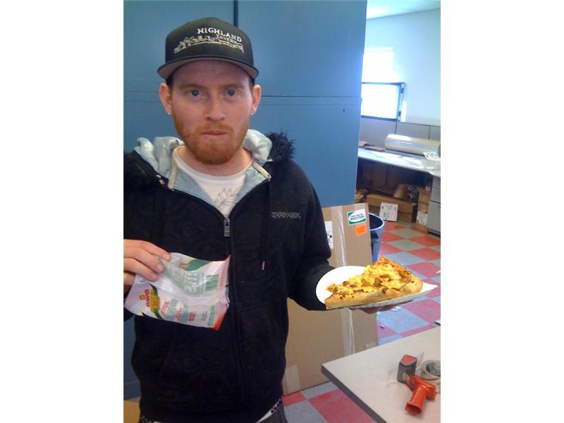 Most Slices Of Pineapple Sausage Pizza Held While Eating Pumpkin Seeds