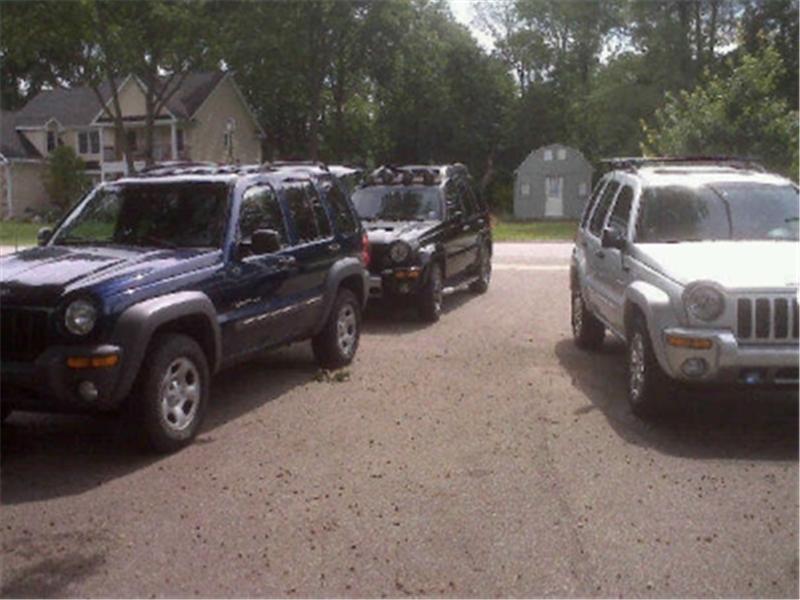 Most Jeep Libertys Parked In A Driveway