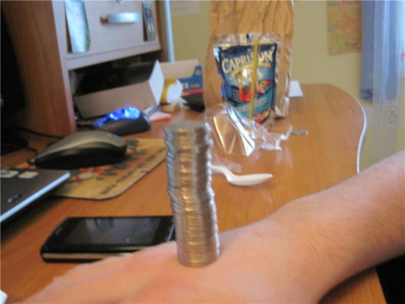 Tallest Nickel Tower Balanced On Hand