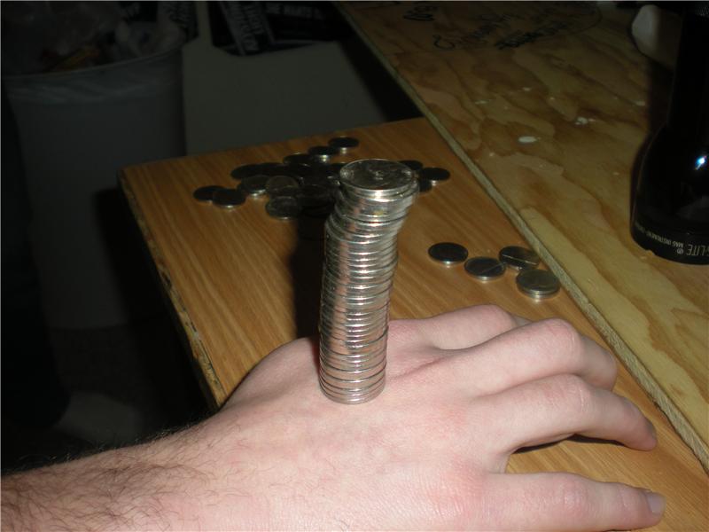 Tallest Nickel Tower Balanced On Hand