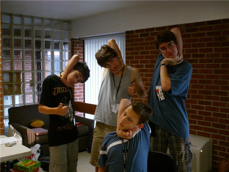 Largest Group Of People Wrapping Arm Around Head To Touch Ear