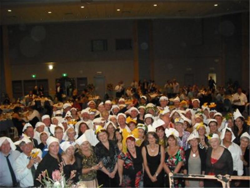 Most People Wearing Dinner Napkins As Hats At A Dinner Party