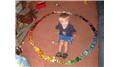 Largest Toy Car Circle Built Around A 3-Year Old