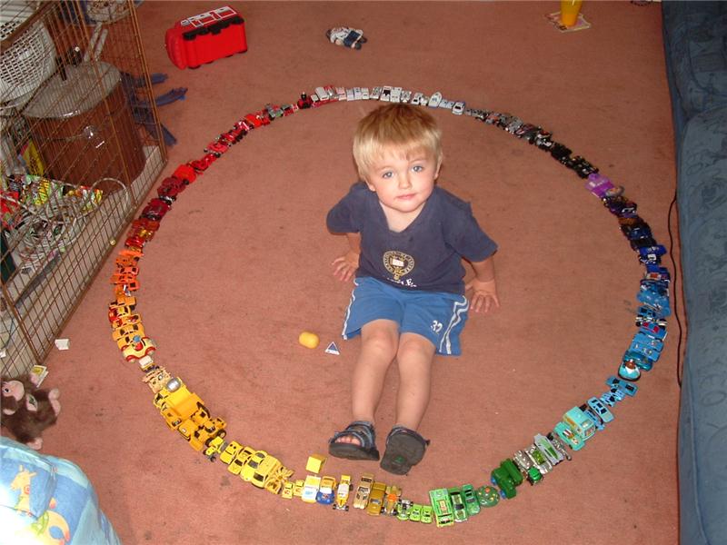 Largest Toy Car Circle Built Around A 3-Year Old
