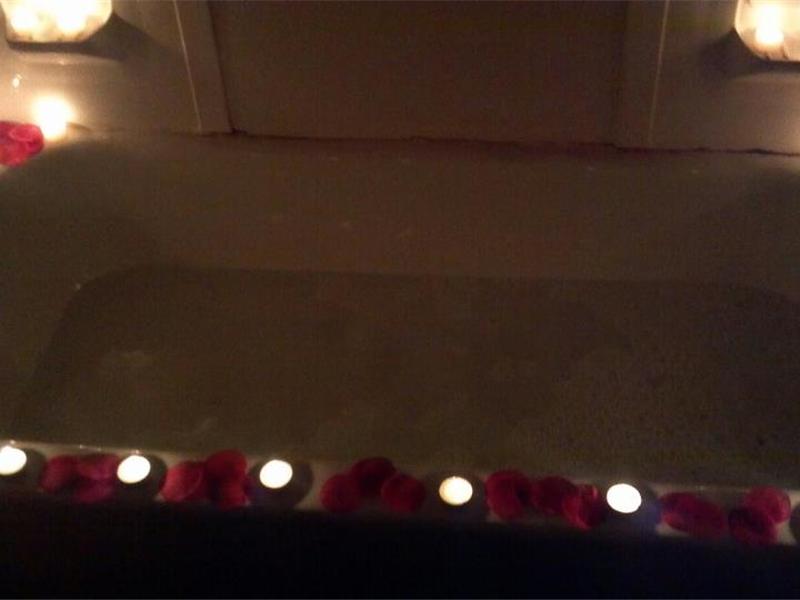 Most Candles Placed Around A Bathtub