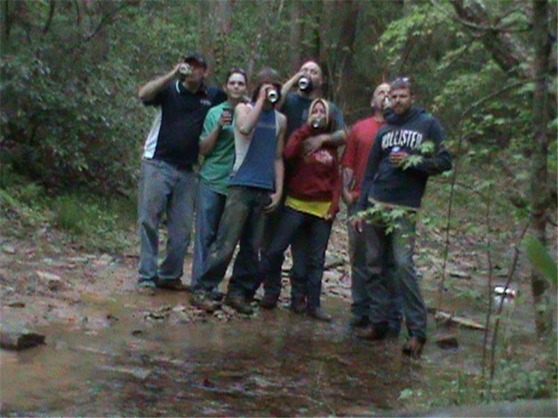 Most People Drinking Beer While Standing In A River