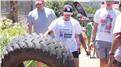 Fastest Time For Two People To Flip A 100-Kilogram Tire 2.5 Kilometers
