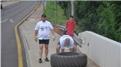 Fastest Time For Two People To Flip A 100-Kilogram Tire 10 Kilometers