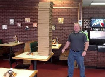 Most Pizza Boxes Held In Hand At Once | World Record | Clint Poore
