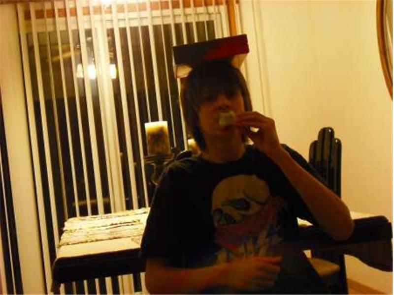 Fastest Time To Eat An Apple With Deck Of UNO Cards Balanced On Head