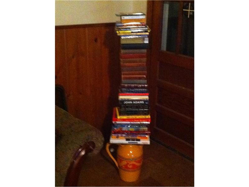 Most Books Stacked On A Vase