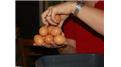 Most Hen Eggs Held In Hand At Once