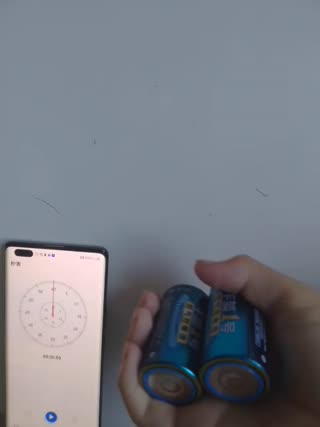Most Alternating Rotations of Two D Batteries in One Hand in 30 Seconds