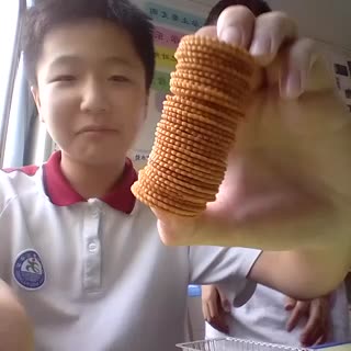 Most Round Crackers Held Between Two Fingers (One From Each Person)