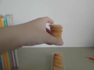 Most Round Crackers Pinched Between Two Pencils