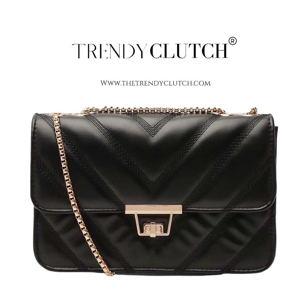 The logo or business face of "The Trendy Clutch"