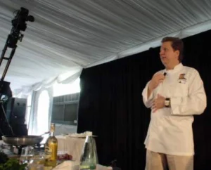 picture of a chef talking in front of people