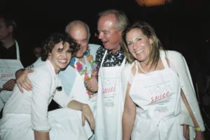 four people dressed in white