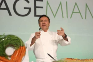 Chef speaking into microphone during event