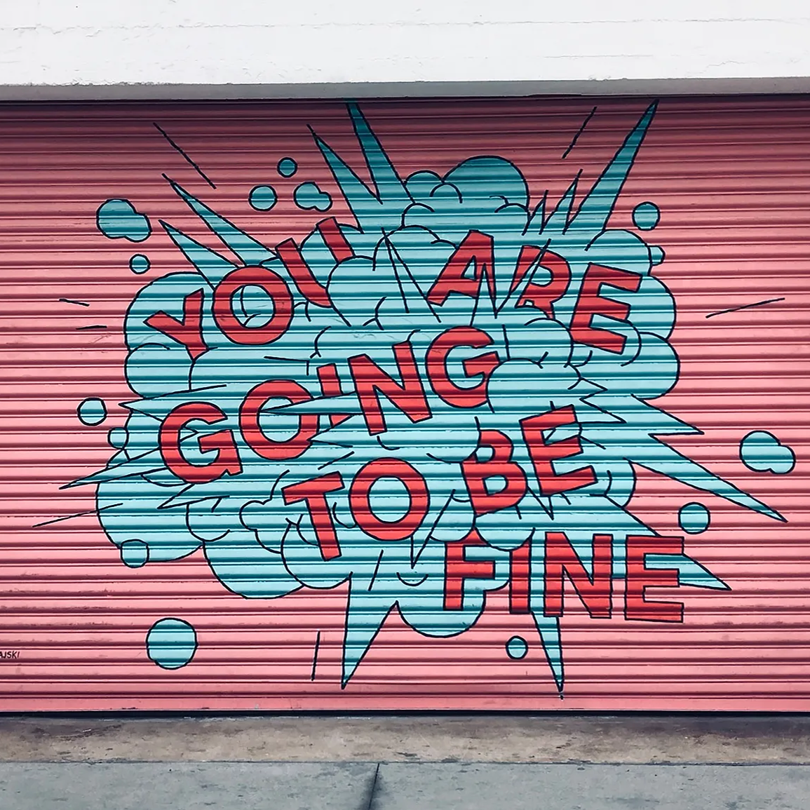 Image of a door with an inspirational saying