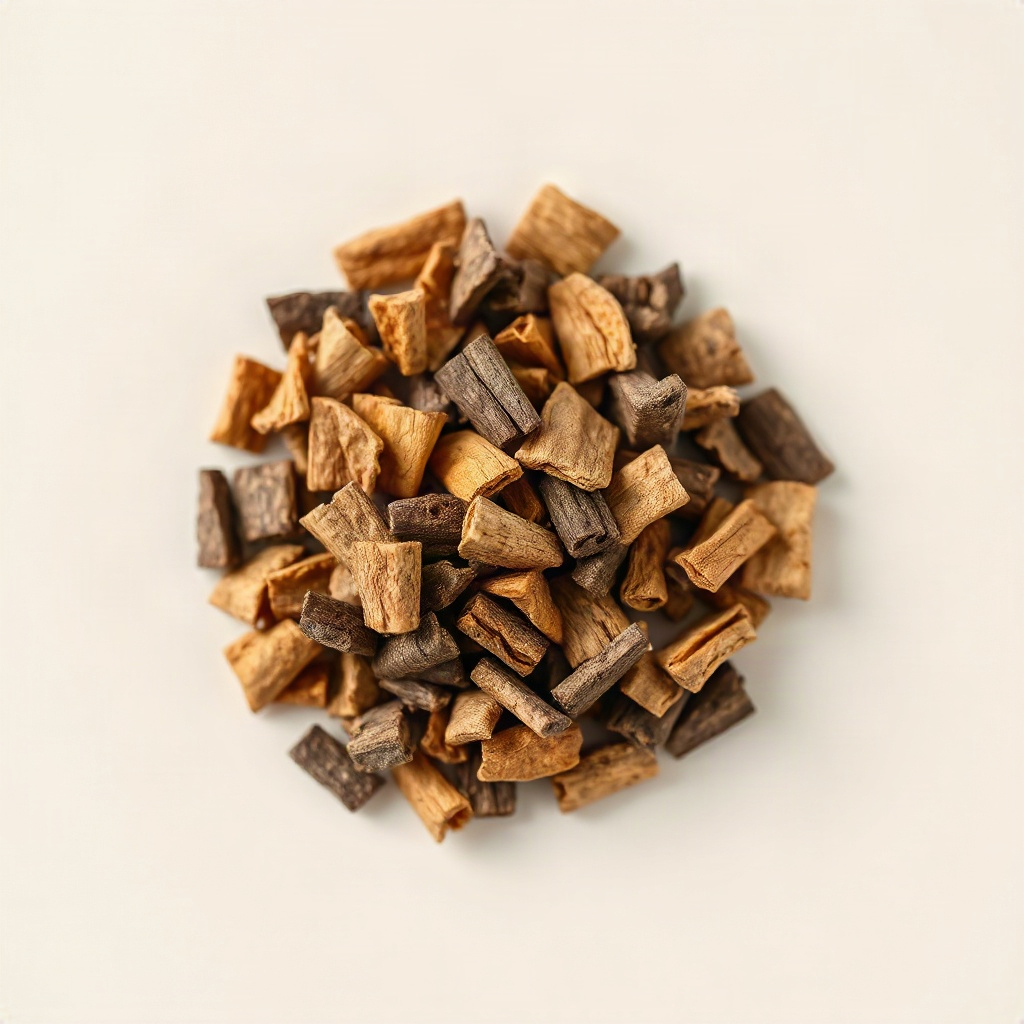 Small circular photo of dried Catuaba bark chips, dark brown woody texture, neutral background, natu