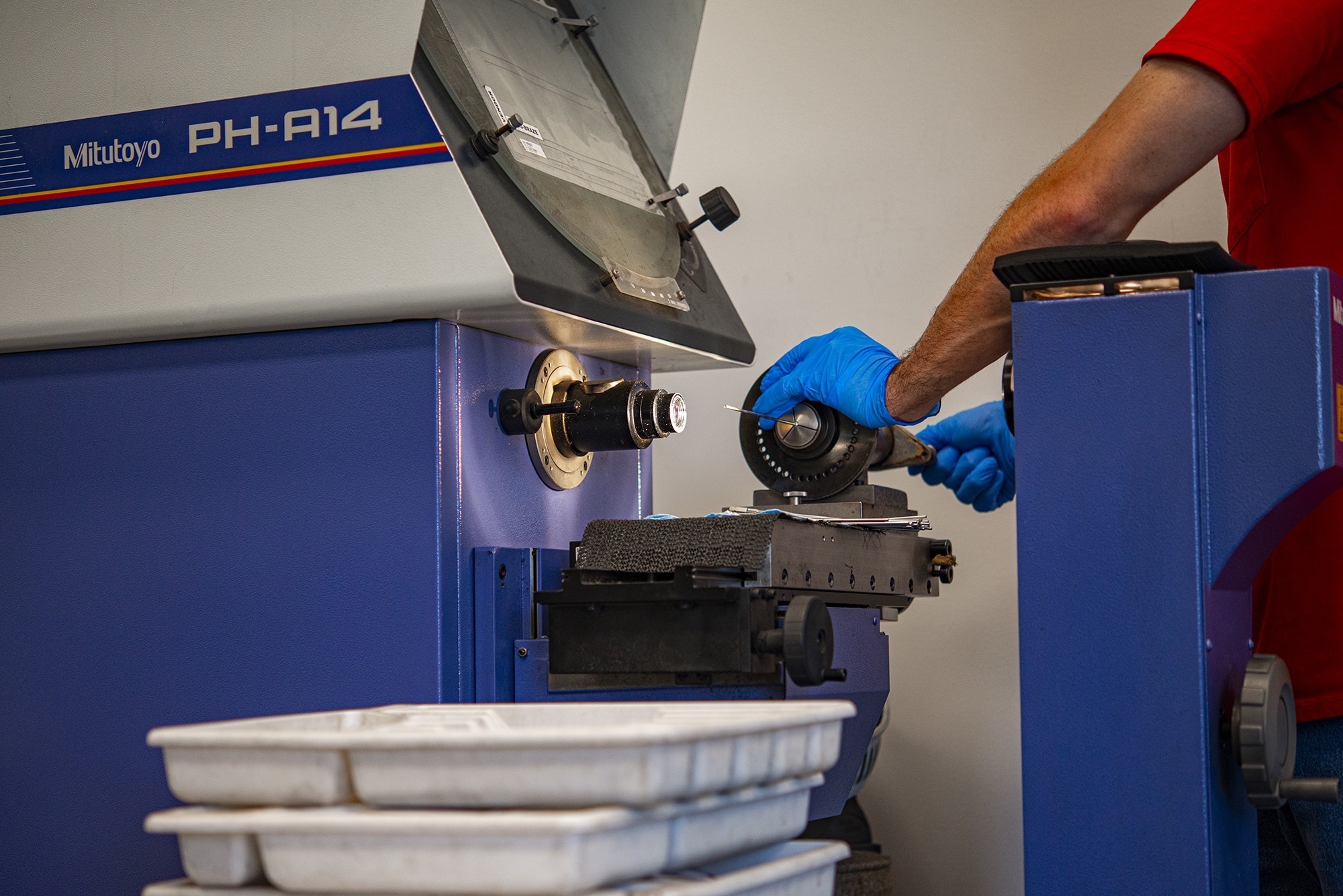 Close up of team member using machinery