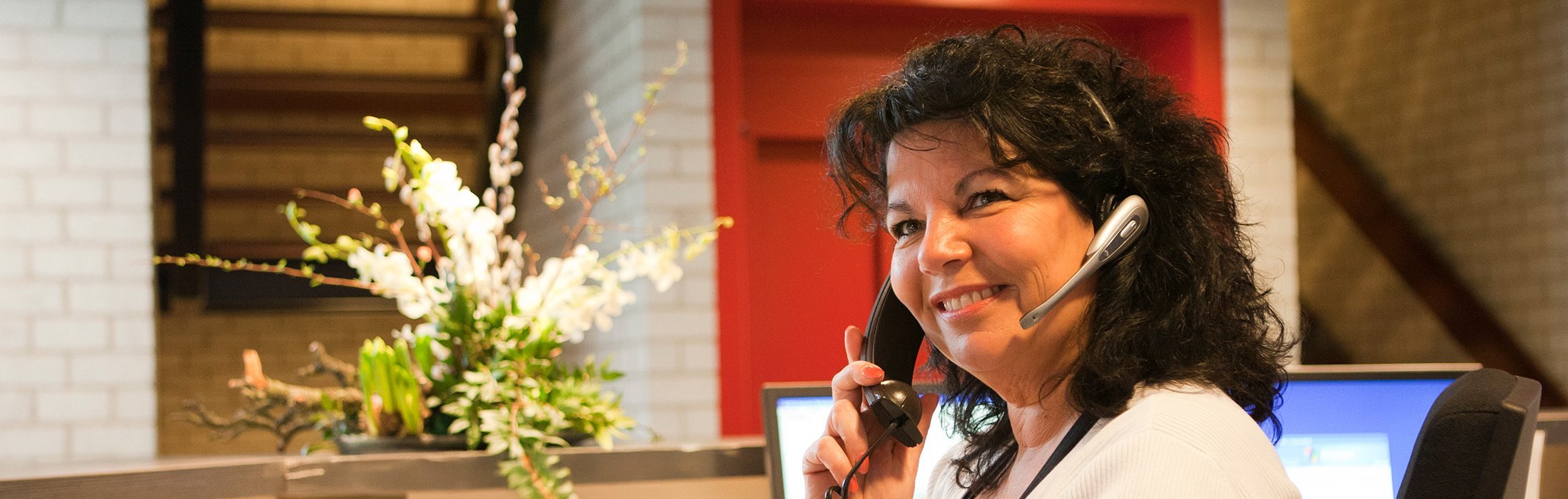 Receptionist talking on phone