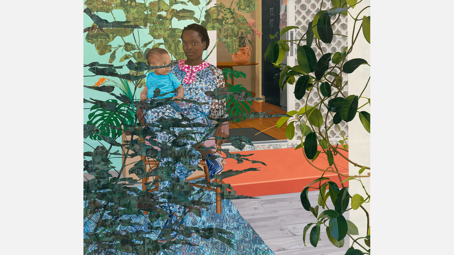 A woman and child sit in a garden full of leaves and colour