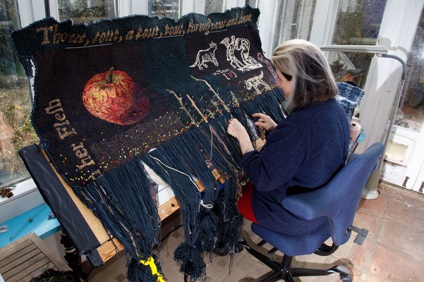 Woman at work on a loom