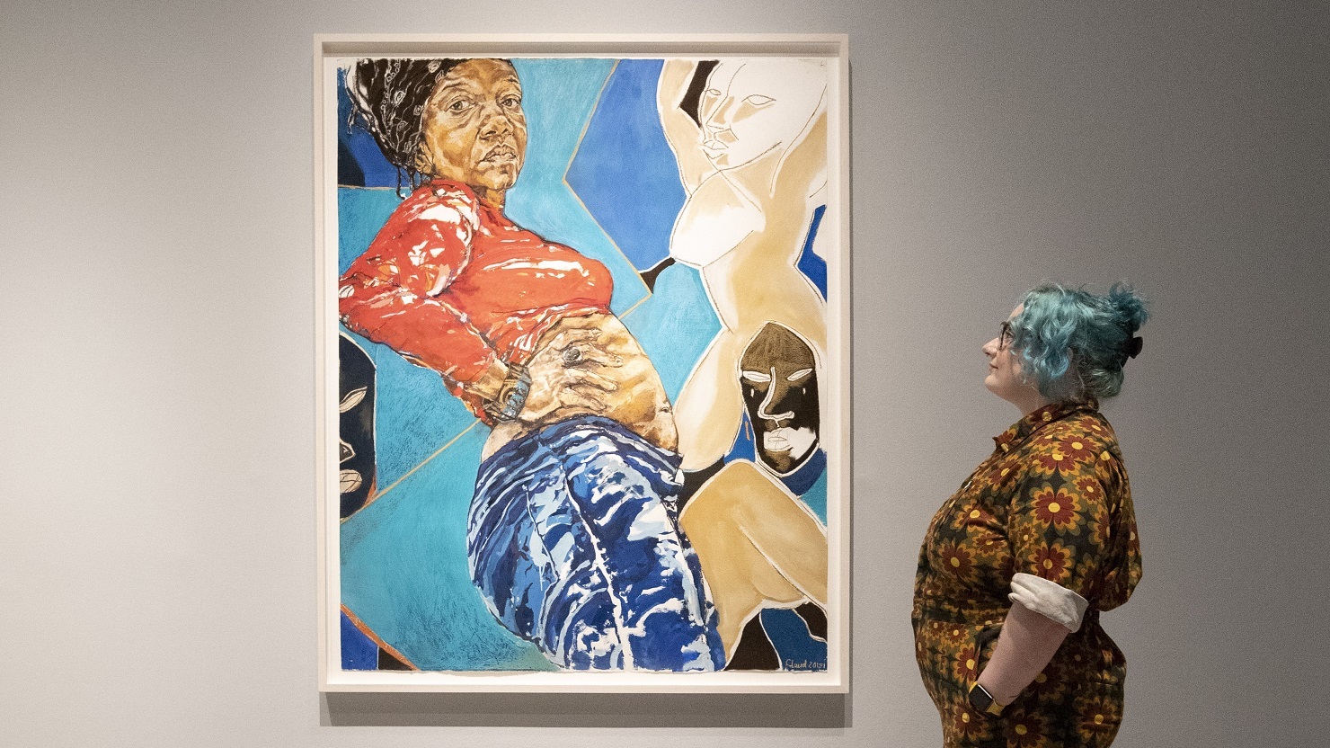 A woman looks at a colourful painting by artist Claudette Johnson at The National Portrait gallery