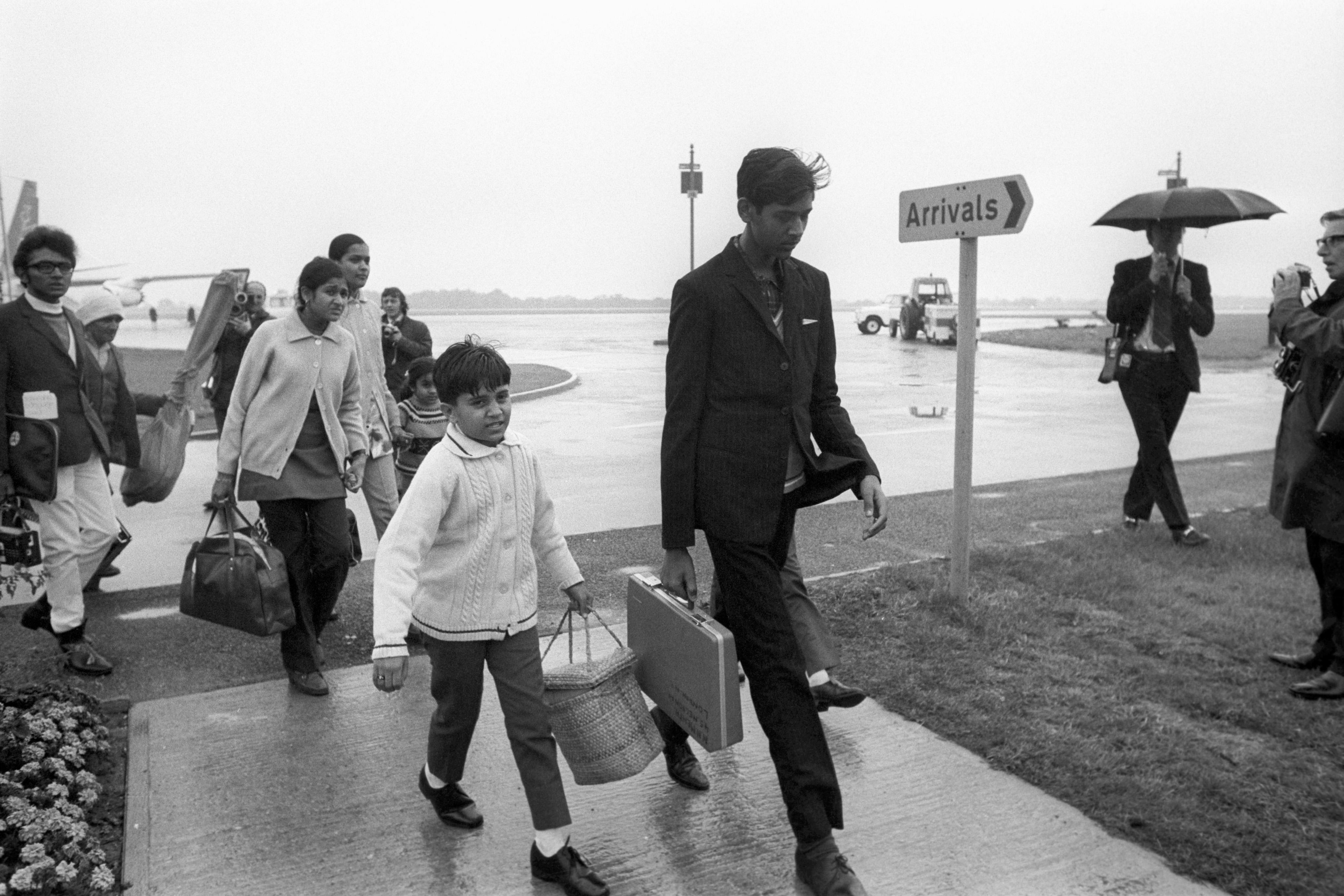 Arrival man and little boy with suitcase