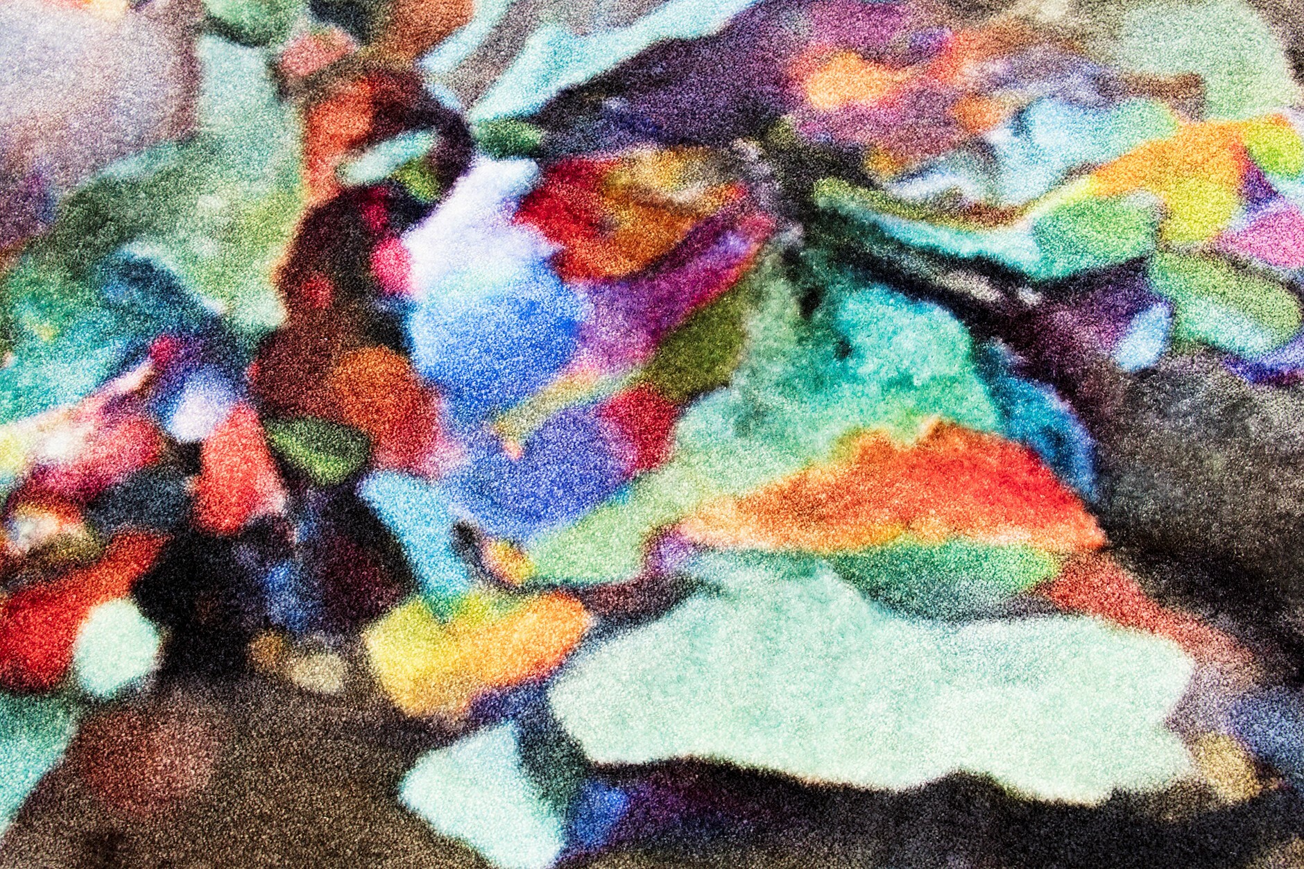 A close-up of artist Celine Condorelli's multicoloured carpet work