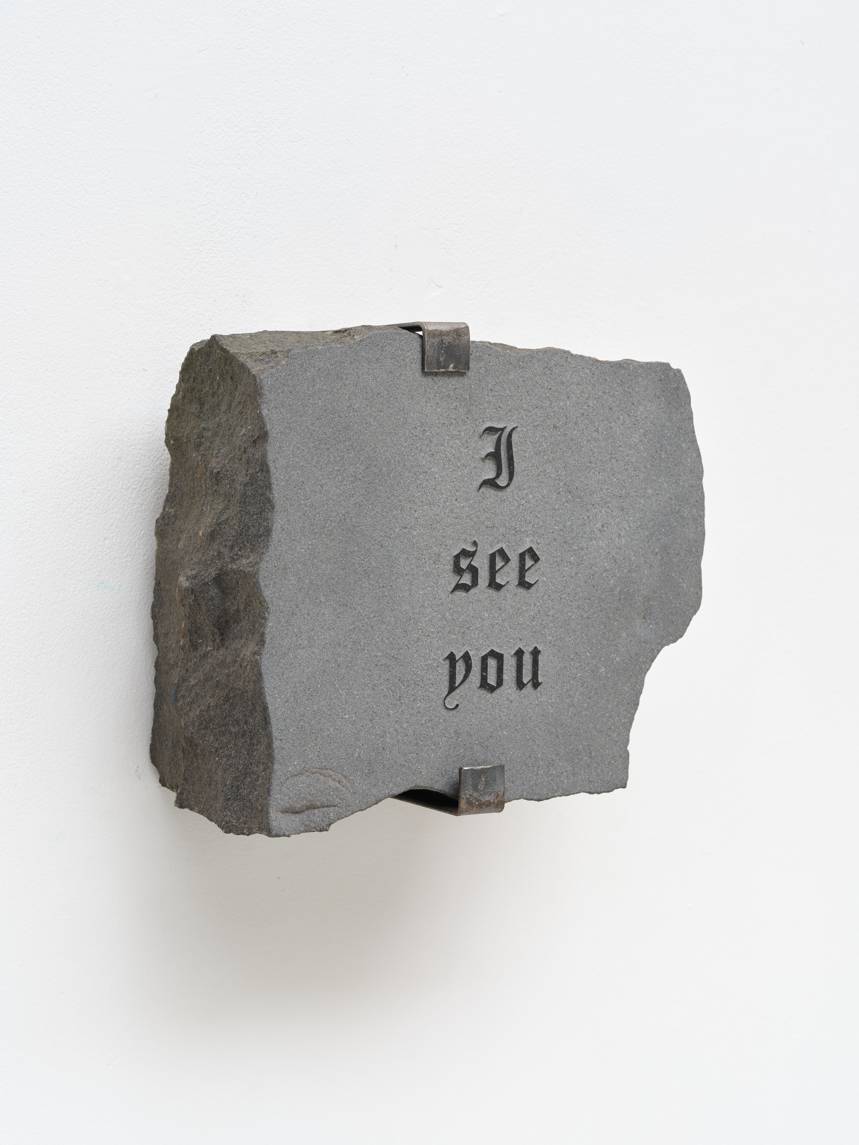 Granite artwork with text which reads 'I see you'