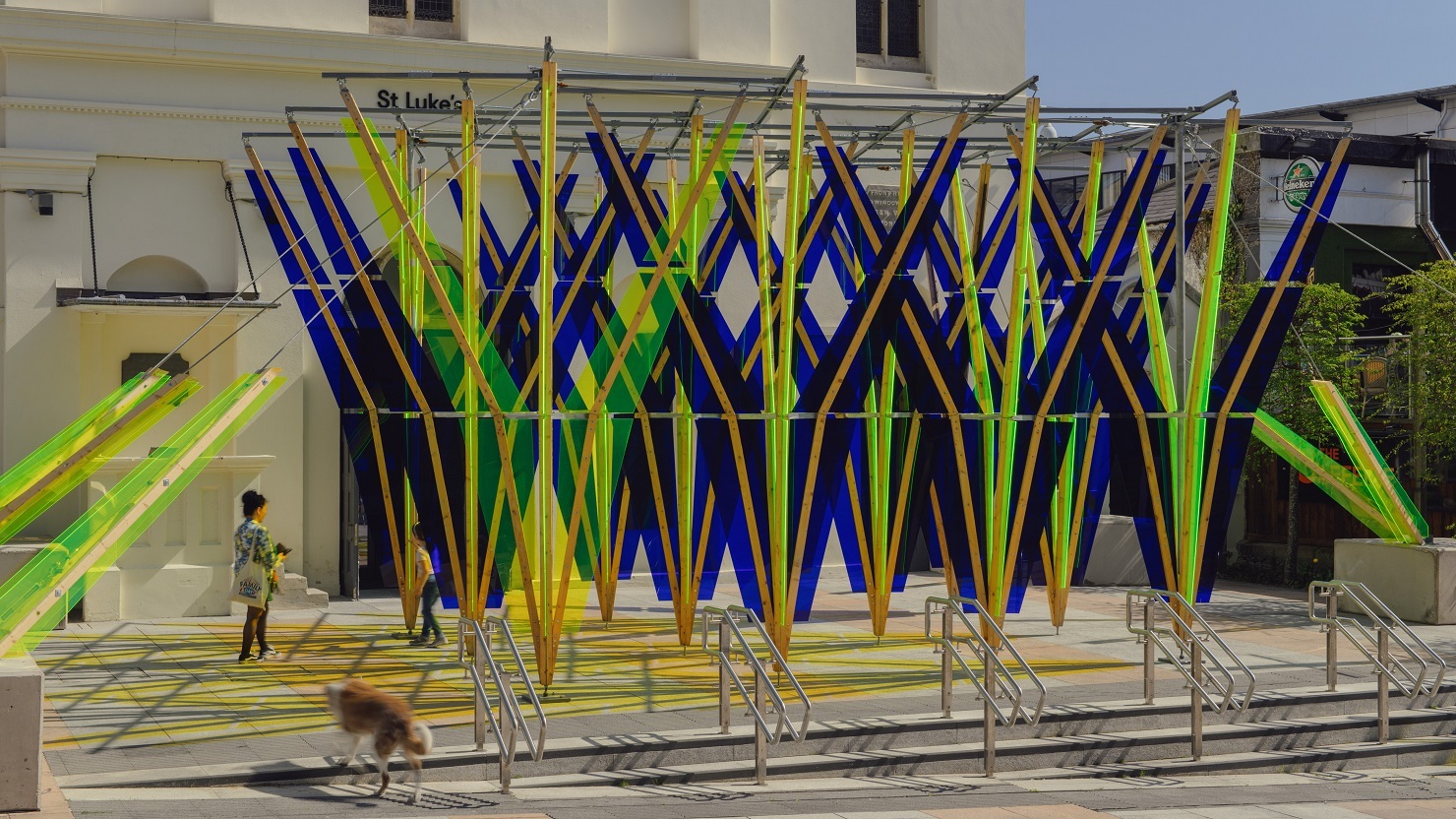 A yellow, green and blue public sculpture on display by artist Jyll Bradley
