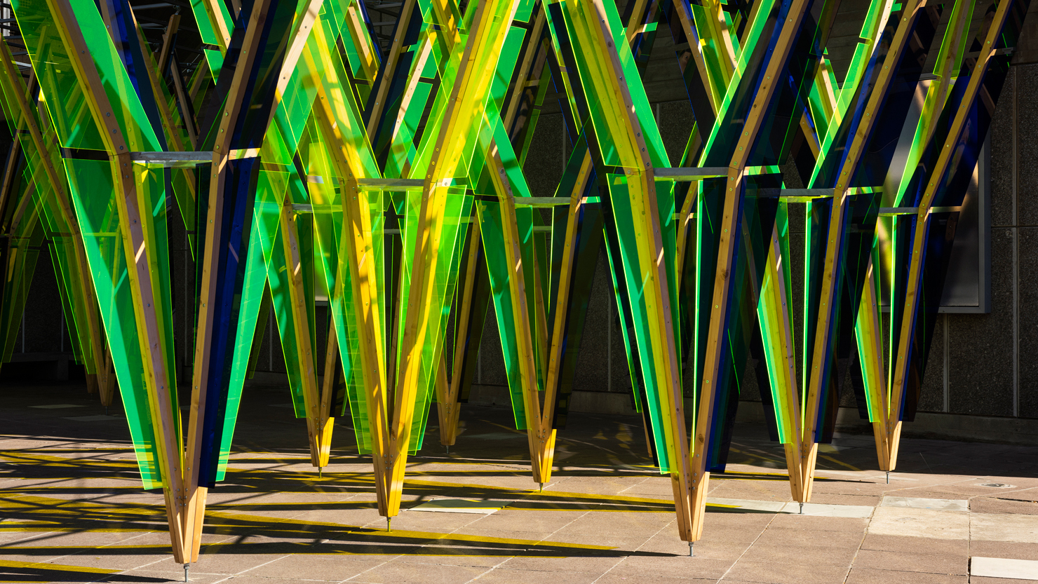 A yellow, green and blue public sculpture on display by artist Jyll Bradley