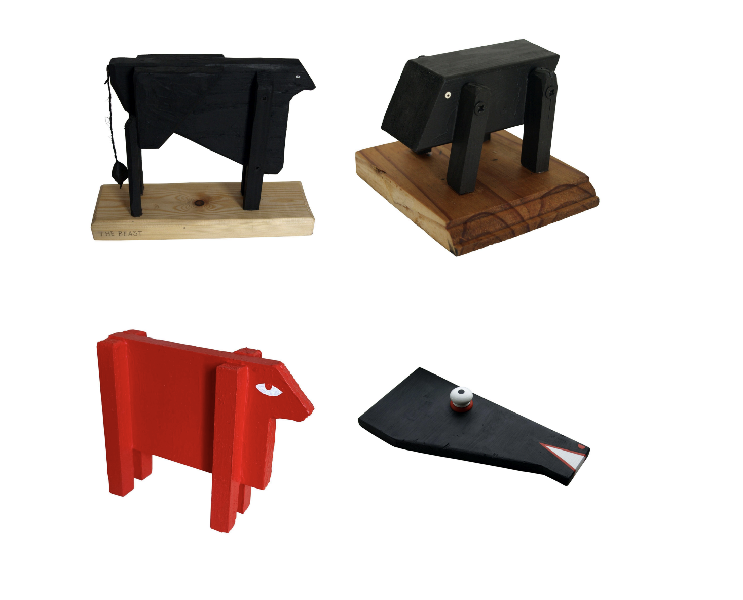 Four wooden sculptures of bull-like beasts