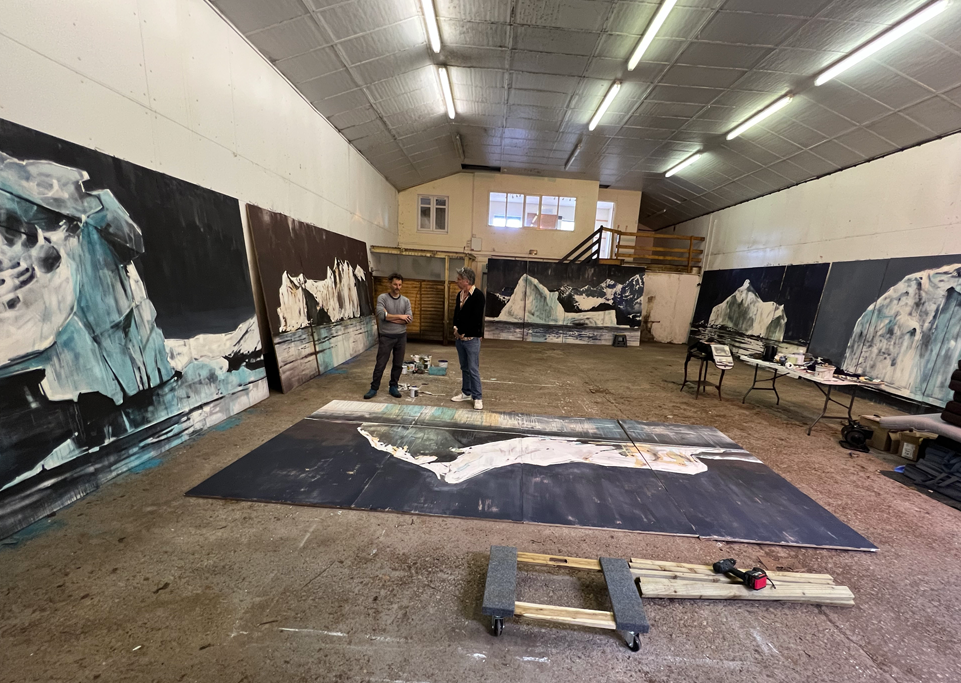 Anthony Garratt working on the six iceberg paintings which will be floated on specially designed structures at tidal locations in South Devon 2024