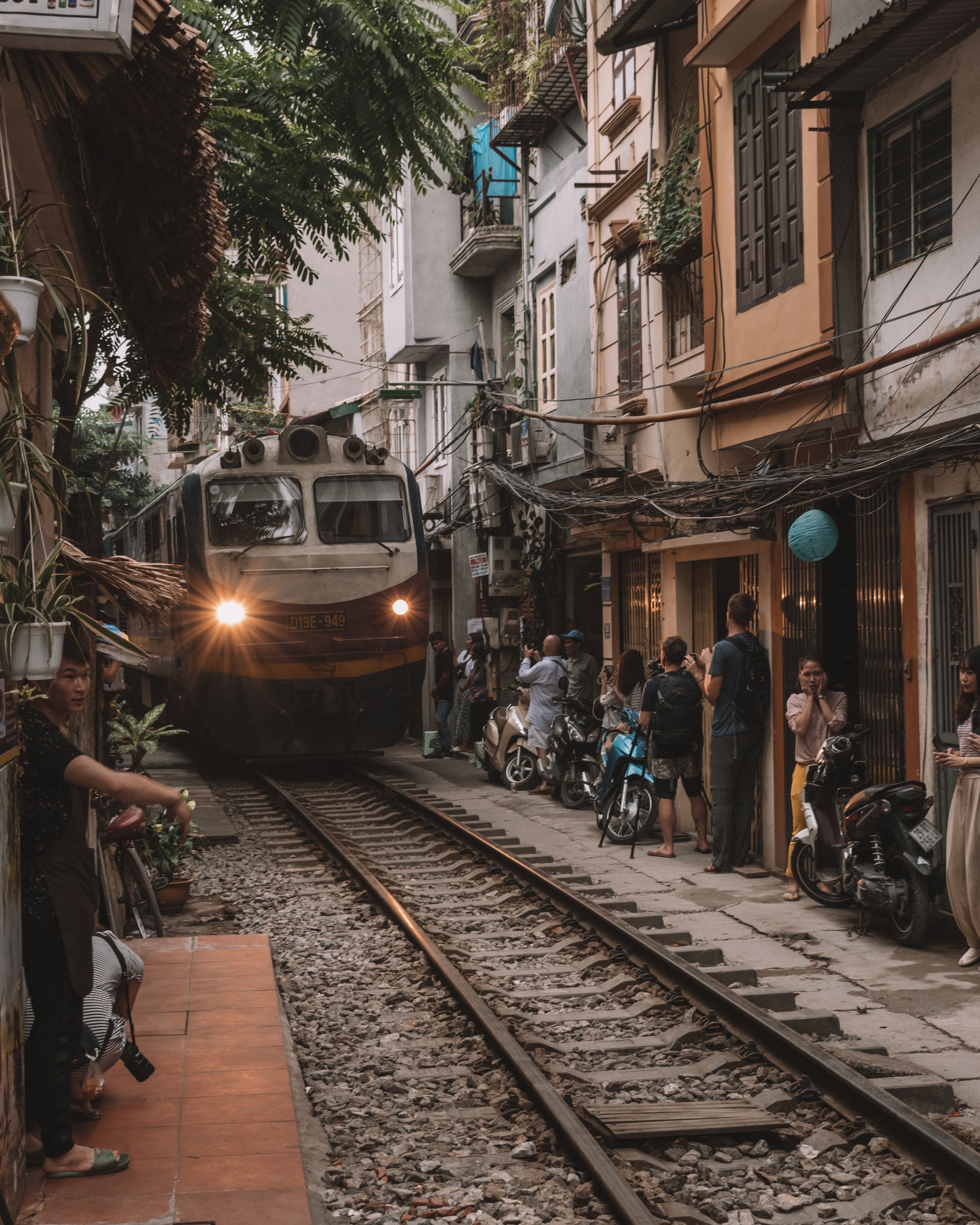 vietnam train driving through the street