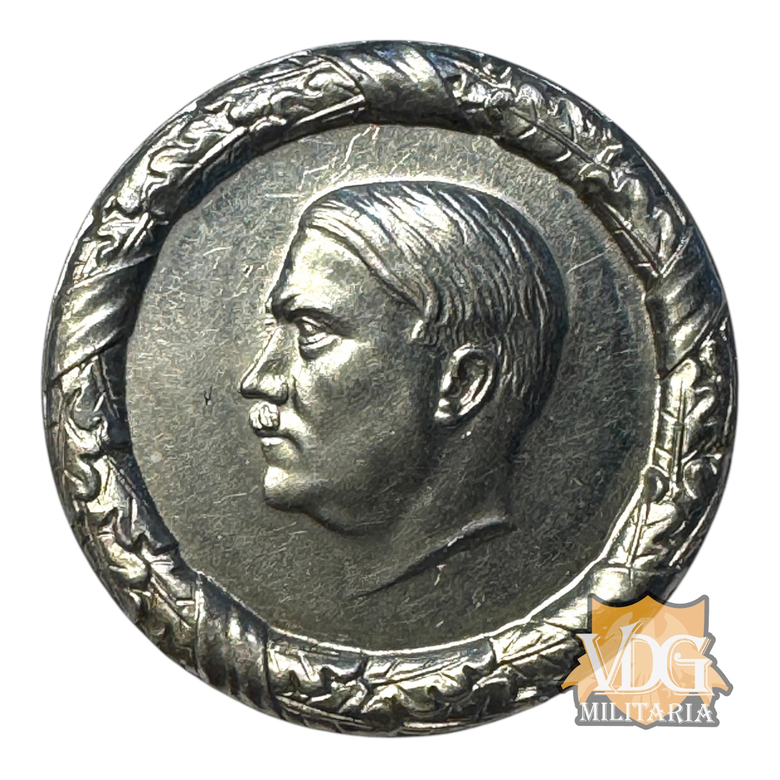 WW2 German Hitler Bust Winterhilfswerk “Der Führer Dankt” Badge, 1935–36 – W.H.W. Donation Pin Tinnie