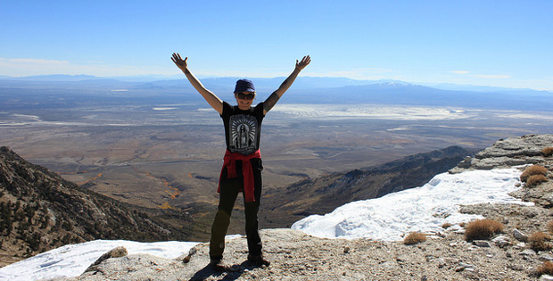 woman on top of mountain