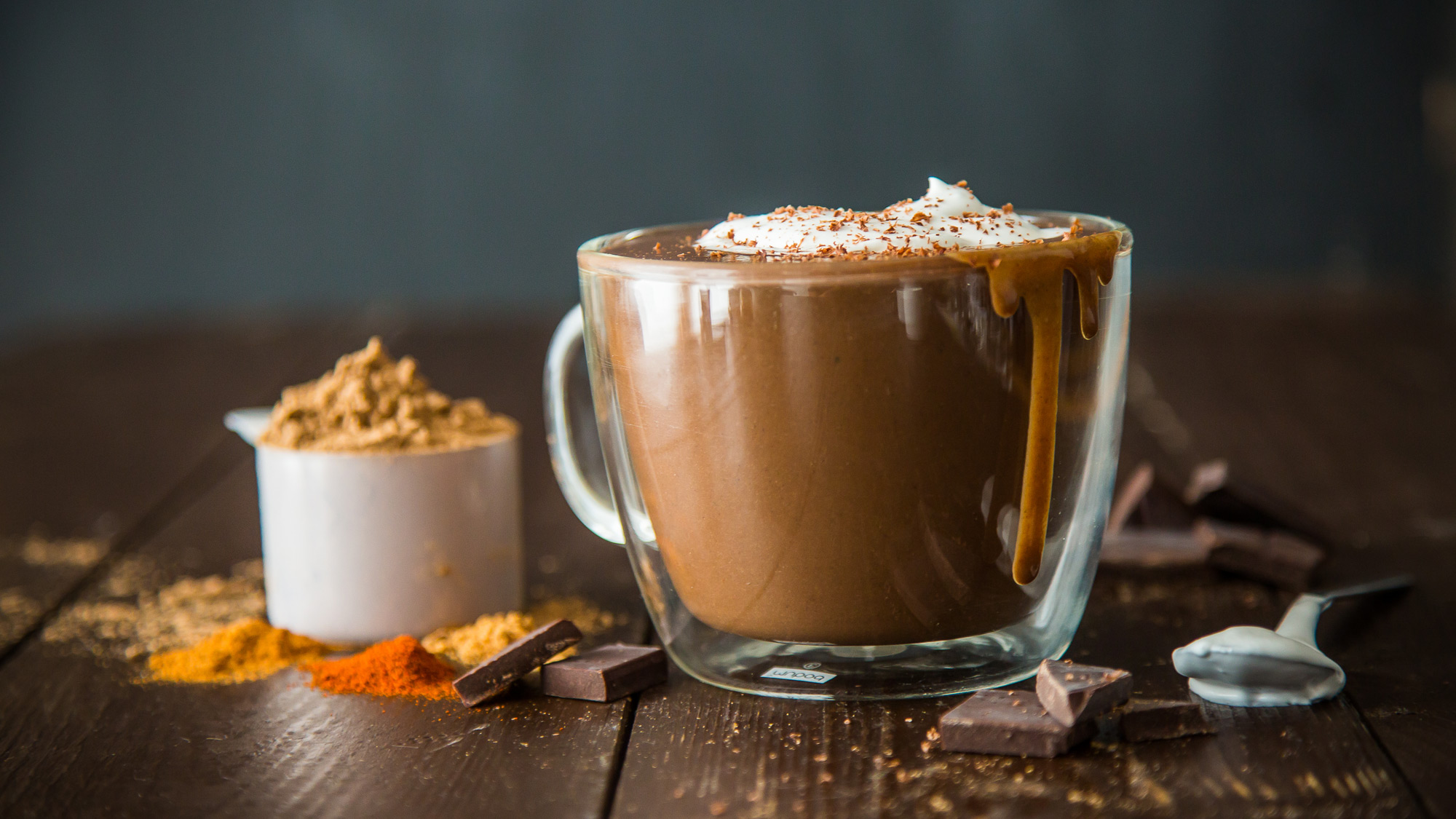 spicy hot chocolate spilling out of a clear mug