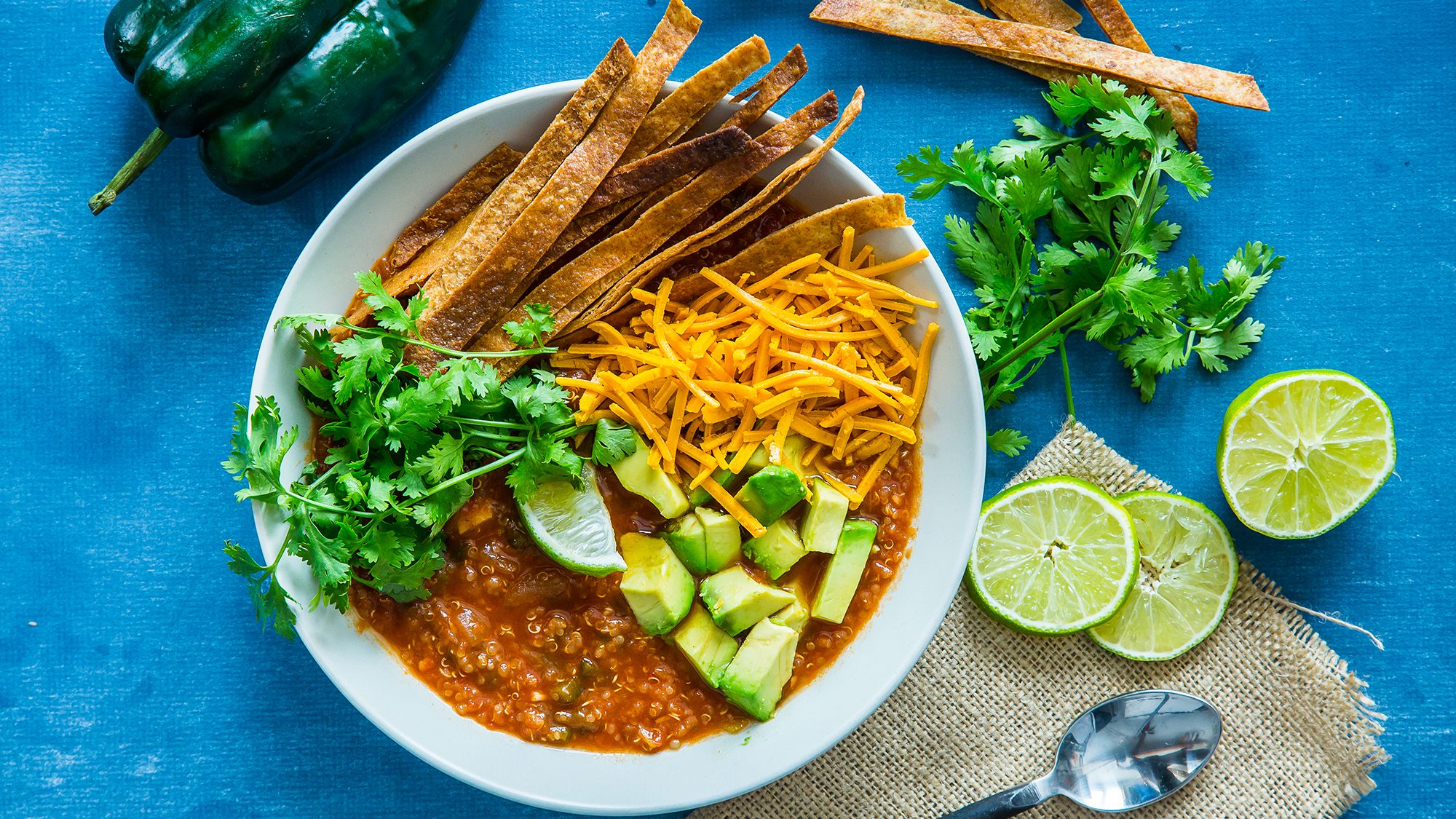 Mexican soup with tortilla chips on top