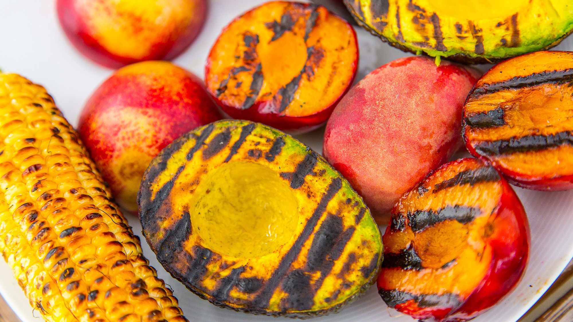 grilled avocados, peaches, and corn