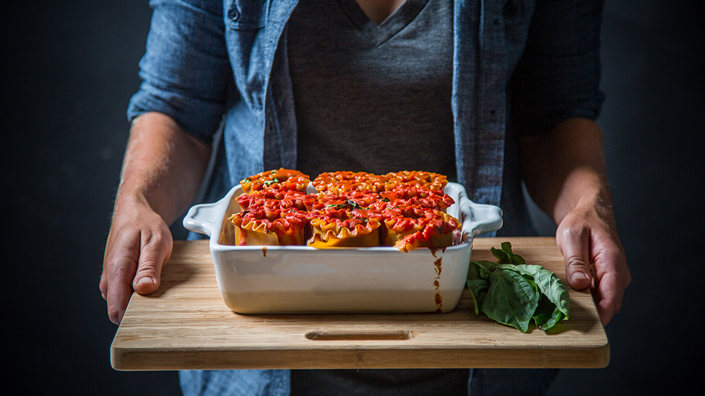 vegan lasagna rolls in a casserole dish